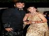 Raj Kundra and his wife Bollywood actress Shilpa Shetty attend a wedding reception in Mumbai on November 24,2009.Shetty,34,best known for winning the British version of television show Celebrity Big Brother, wed Raj Kundra in Khandala,a hill resort near Mumbai on November 22, with friends,family and showbusiness colleagues attending the Hindu service and all-night celebrations.