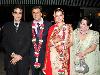 Indian Bollywood actors Jitendra(L)and his wife Shobha(R)poses with wedding couple Neelam Kothari(2R)and Sameer Soni(2L)as part of their wedding ceremony in Mumbai on January 23,2011.