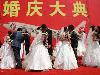 Sometimes weddings can be just like going to the bathroom - something you'd really rather not go alone.This mass ceremony for the staff of China Air includes pilots and flight attendants.So who was flying the planes?